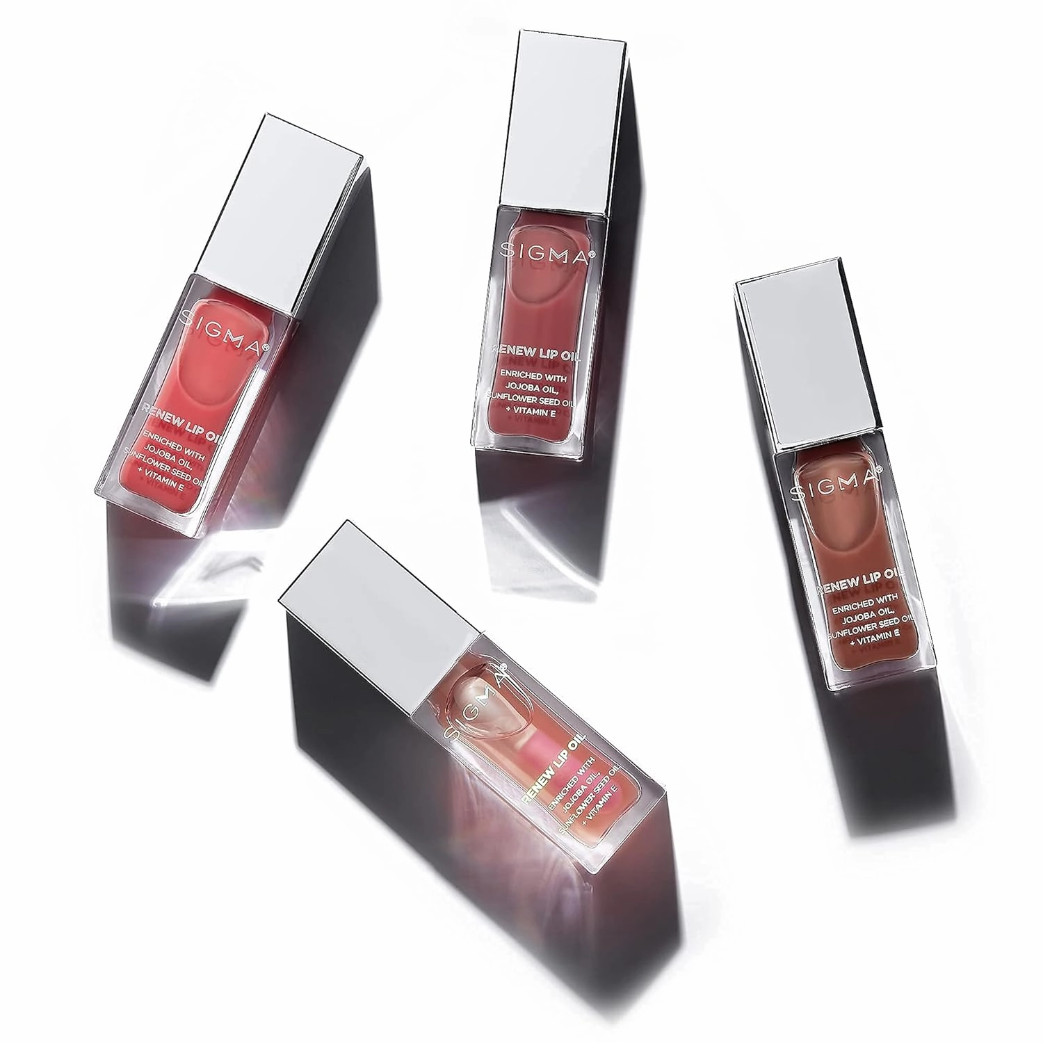 Sigma Beauty Renew Lip Oil Bundle - Includes 4 Nourishing, Non Sticky Lip Oils with Subtle Sheen - Paraben Free Lip Gloss - Lip Oils for Soft, Supple, & Shiny Lips - Tint, Tranquil, Hush & All Heart